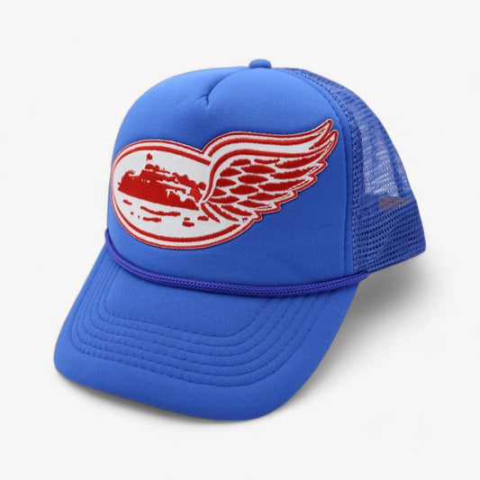 Corteiz Alcatraz Wing “Blue” Trucker Hat